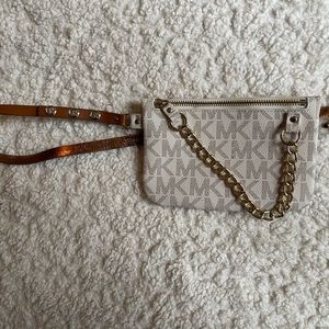 White and gold Michael Kors belt bag.